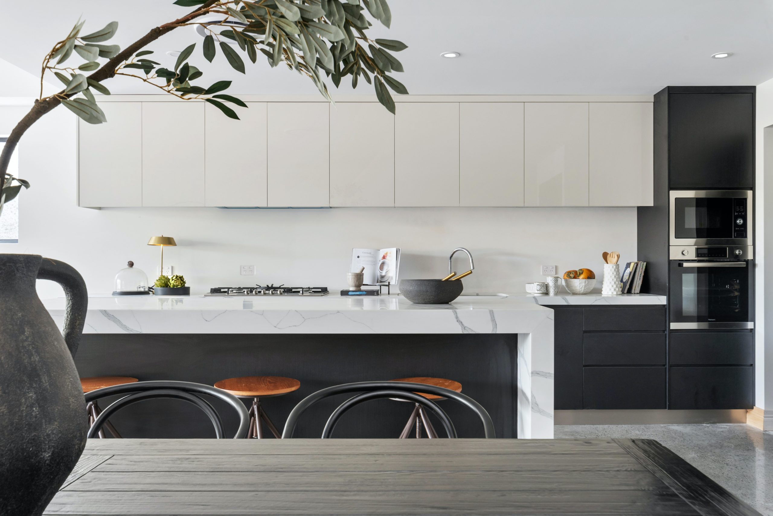 Two tone kitchen cabinets - dark grey island white uppers
